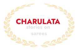 Logo design featuring the word "CHARULATA" in bold red uppercase letters, with the subtitle "stories on sarees" in light gray lowercase letters beneath it, surrounded by a decorative golden-yellow laurel wreath on a light background.